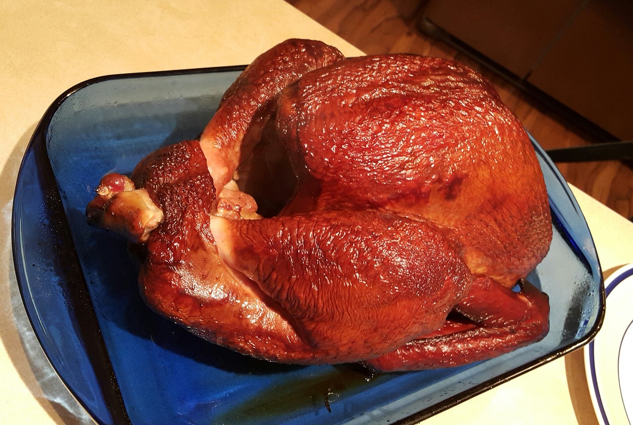A Thanksgiving turkey sitting on the kitchen counter