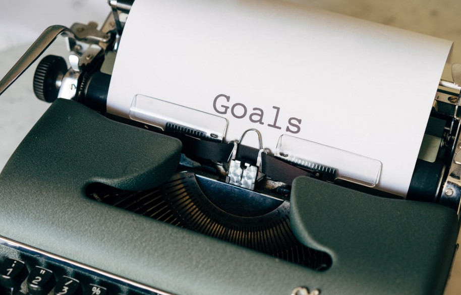 Old style typewriter with the paper saying, "Goals"