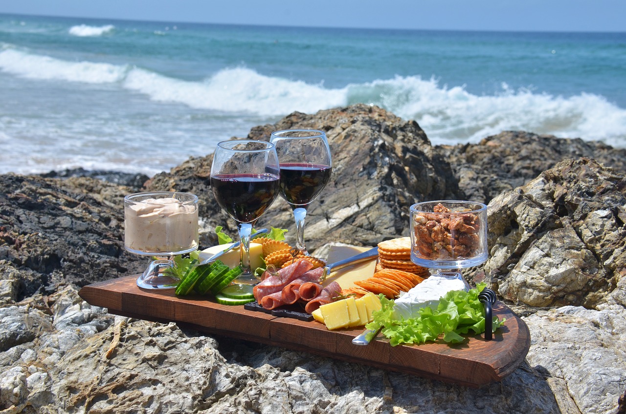 cheese platter and wine overlooking the ocean