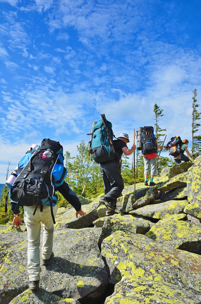 group hiking up a mountain