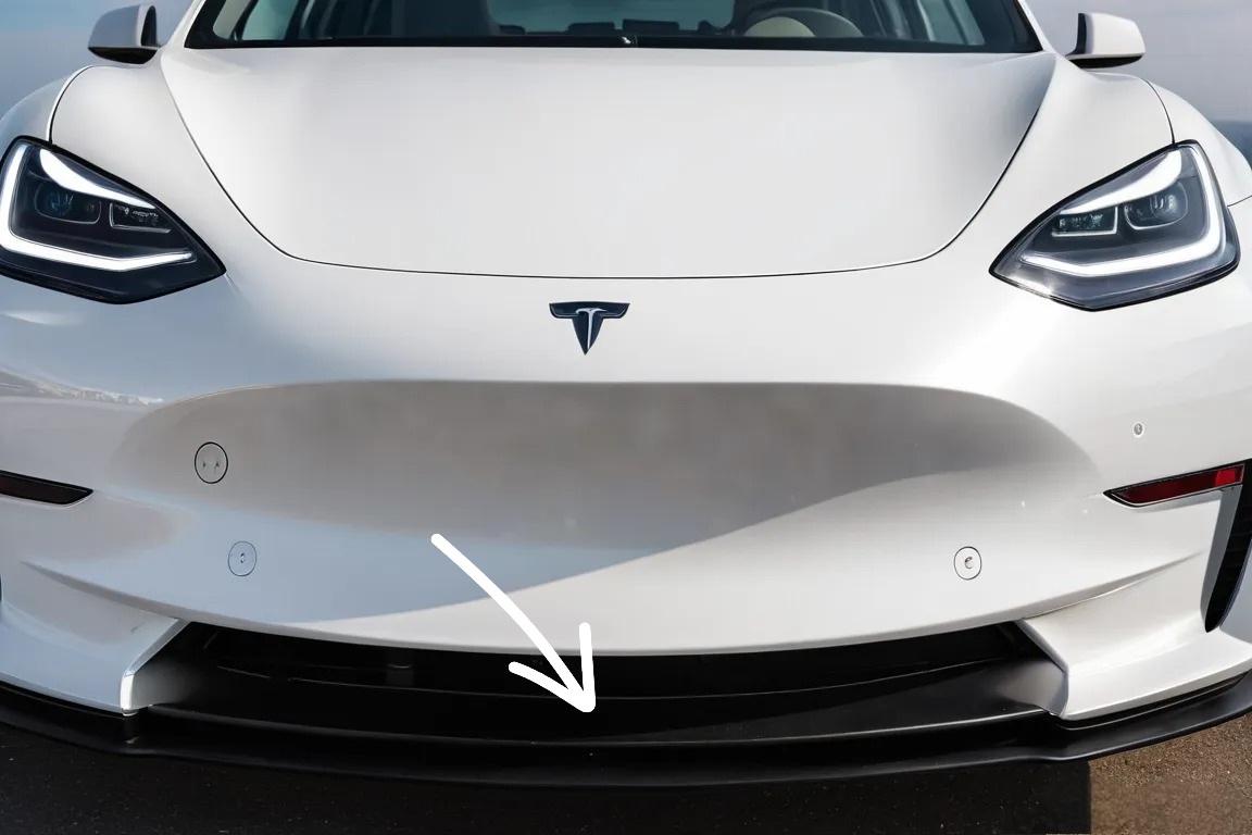 Front bumper section of a white Tesla